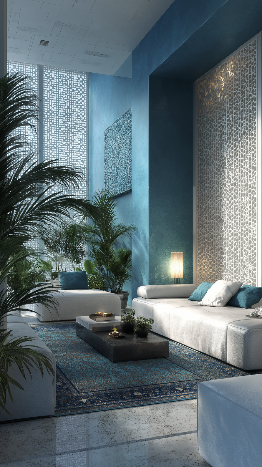 Salon lumineux à Marrakech conçu par JBB architecte d’intérieur, avec murs bleu turquoise, canapés blancs et plantes tropicales dans une atmosphère paisible et raffinée